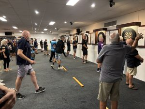 Players competing in darts match at Bluewater Darts Association
